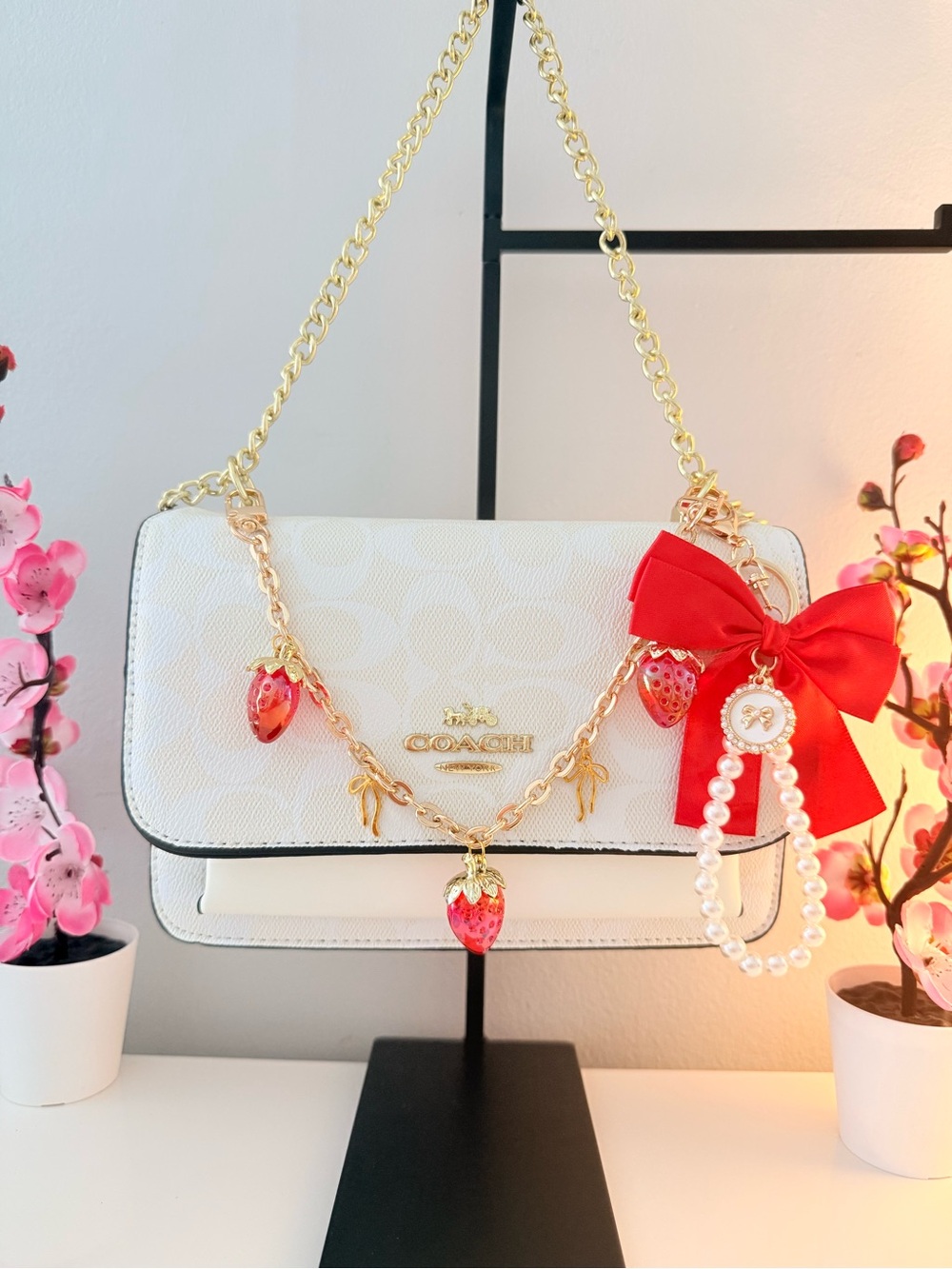 Coach White Shoulder Bag with Red Strawberry Charms and Red Bow Accent